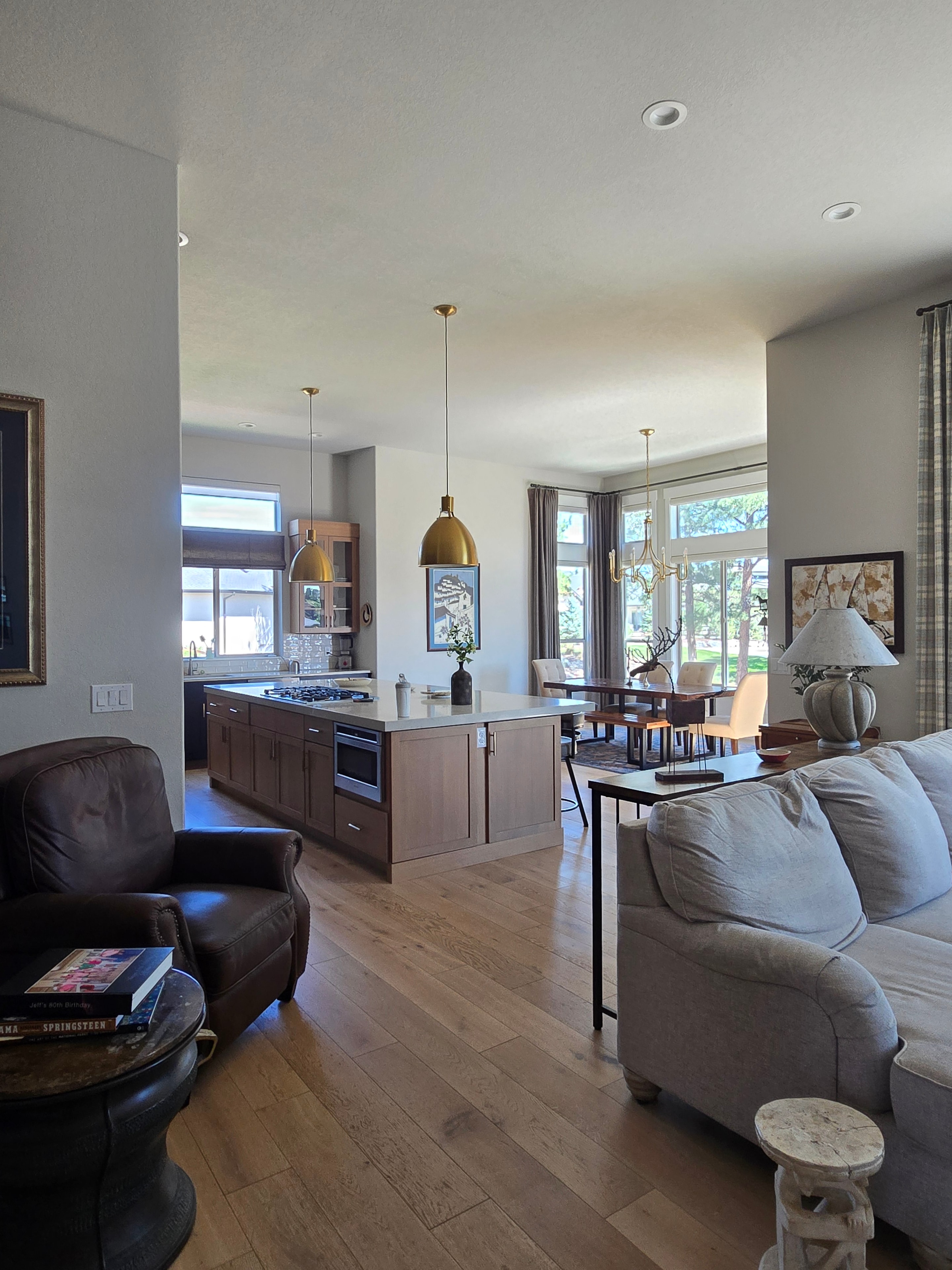 Professional cleaning team holding supplies in a bright home
